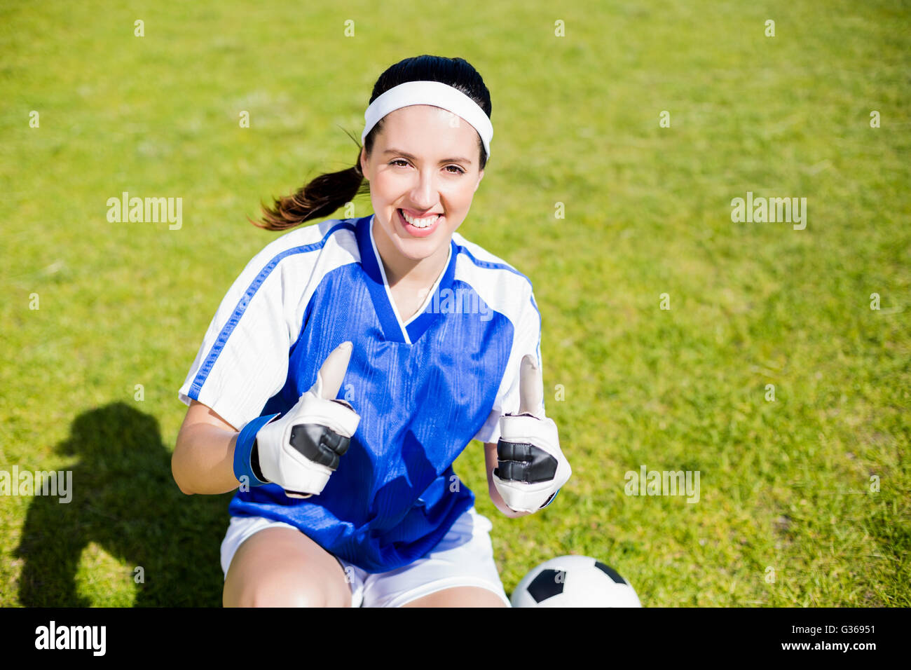 Happy soccer player showing her thumbs up Stock Photo Alamy