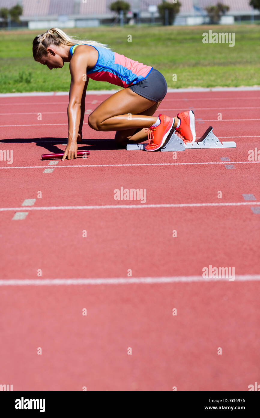 Female athlete ready to start the relay race Stock Photo Alamy