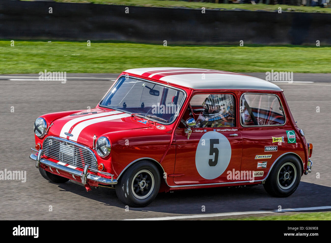 1964 Austin Mini Cooper S with driver Joeg Weidinger, St Mary's Trophy race, 2015 Goodwood Revival, Sussex, UK. Stock Photo