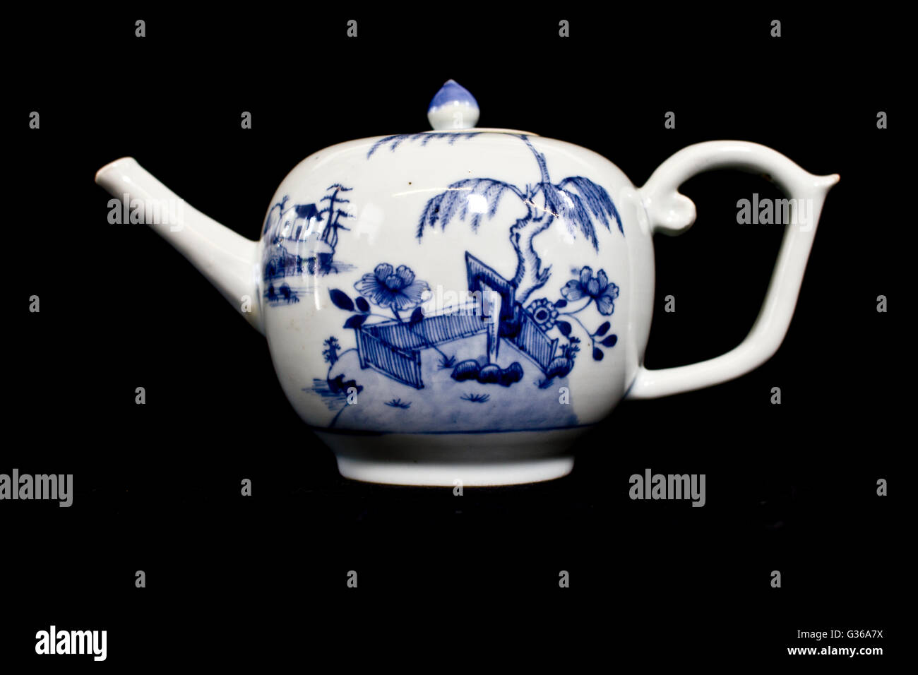 Blue and White Antique Chinese Teapot on Black Background Stock Photo