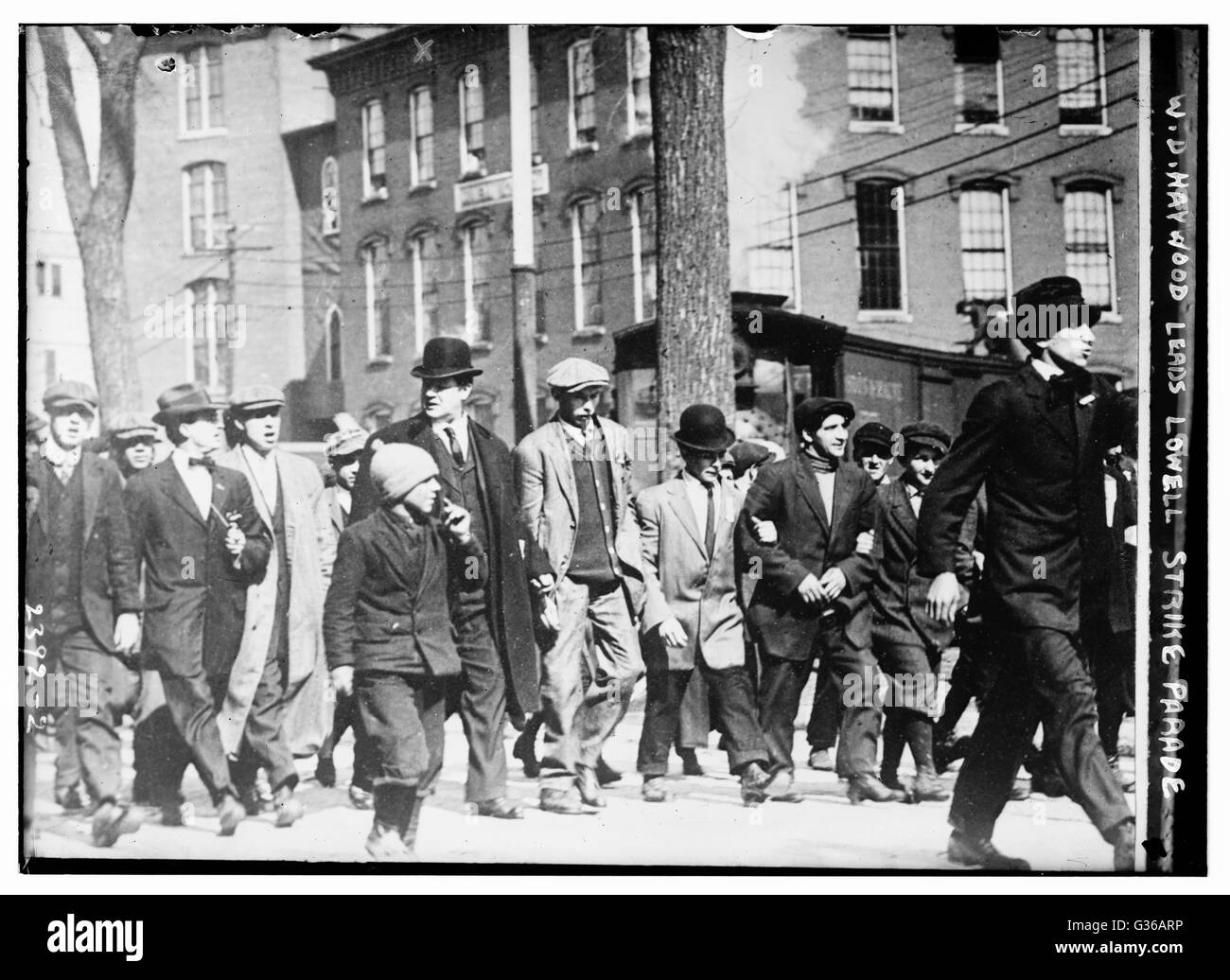 William Dudley (Big Bill) Haywood (center left with bowler hat), an American labor movement leader, marching with strikers in Lowell, Massachusetts. Stock Photo