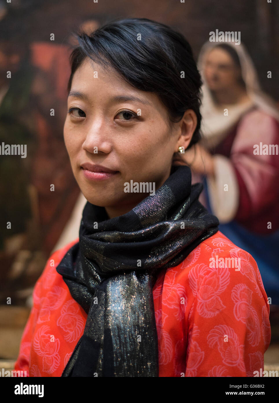Conservator Youjin Noh, in front of Sebastiano del PiomboÃ•s (1485Ã1547) Adoration of the Shepherds c. 1510, at the Fitzwilliam Museum in Cambridge after a a 10-year research and conservation project, the painting will go on show for the first time in 70 years. Stock Photo