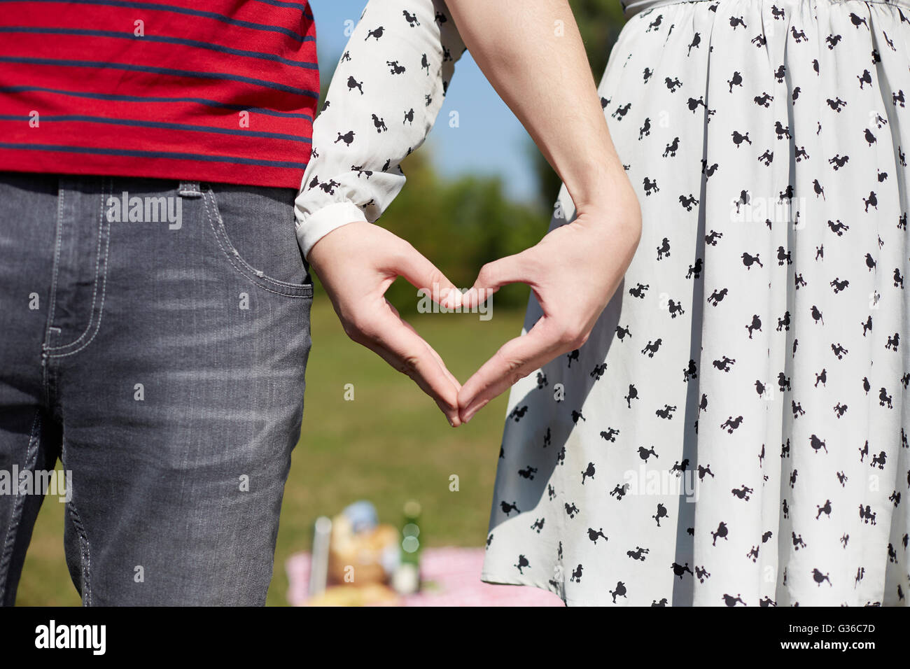 Valentines couple make heart shape with hands Stock Photo - Alamy