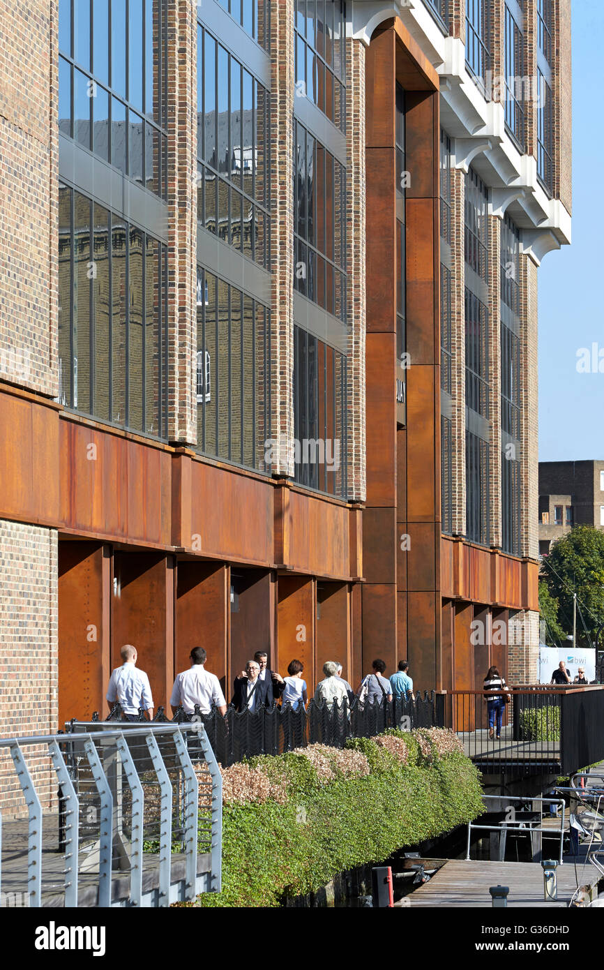 Brick facade and walkway. Commodity Quay, London, United Kingdom. Architect: BuckleyGrayYeoman, 2014. Stock Photo