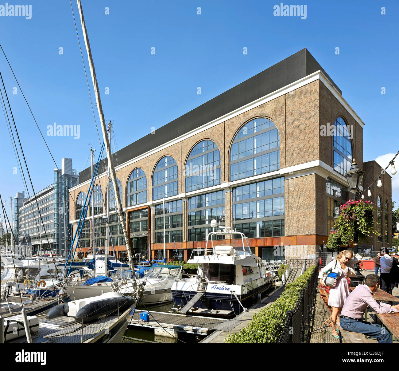 Context view of marina with yachts. Commodity Quay, London, United Kingdom. Architect: BuckleyGrayYeoman, 2014. Stock Photo
