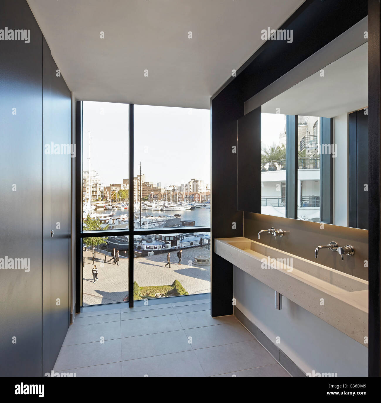 Bathroom with full-height glazing. Commodity Quay, London, United Kingdom. Architect: BuckleyGrayYeoman, 2014. Stock Photo