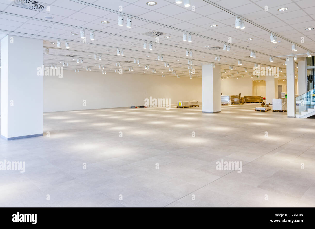 Furnishing equipment is on the floor for white room with ceiling light