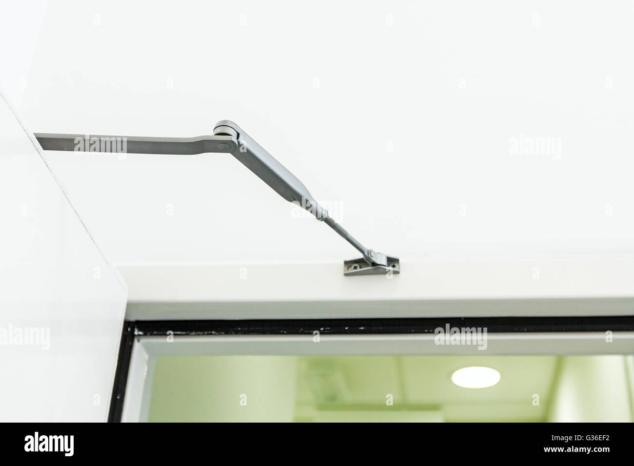 Automatic hydraulic device, leaver hinge door closer holder, detail Stock Photo