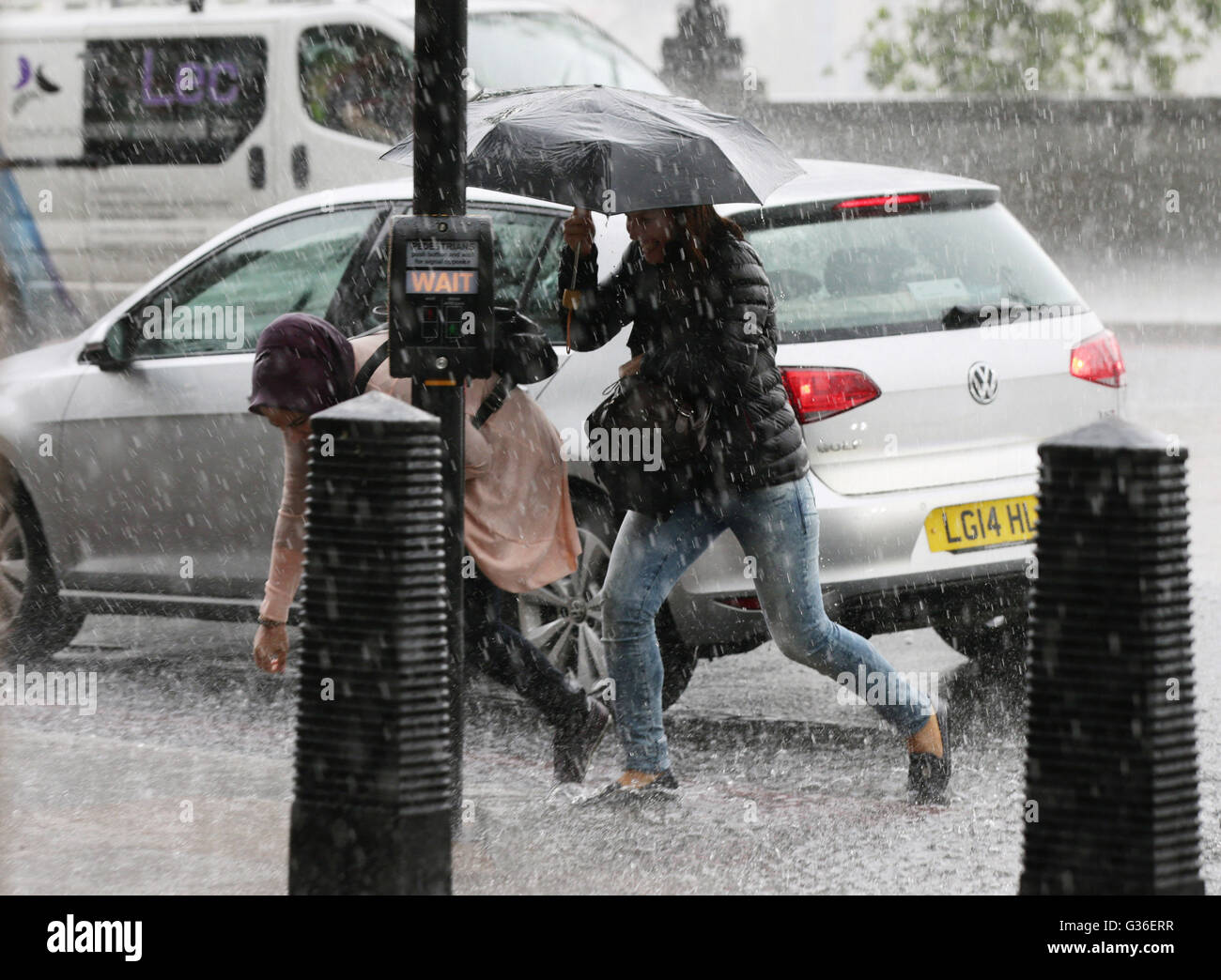 People are caught out in heavy rain in westminster hires stock photography and images Alamy