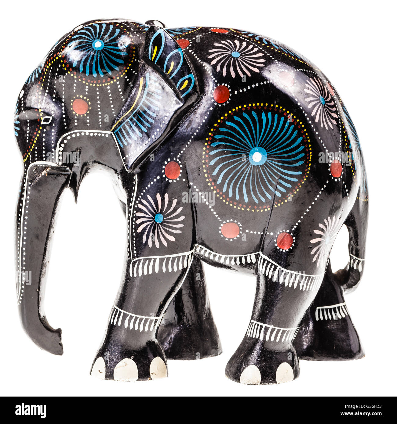 a decorated wooden black elephant figurine isolated over a white ...