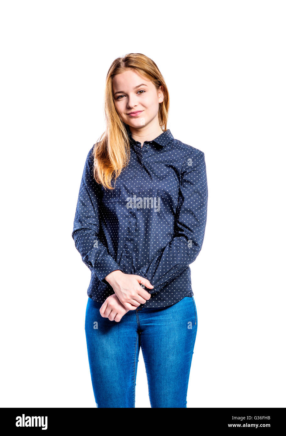 Girl in jeans and shirt, young woman, studio shot Stock Photo