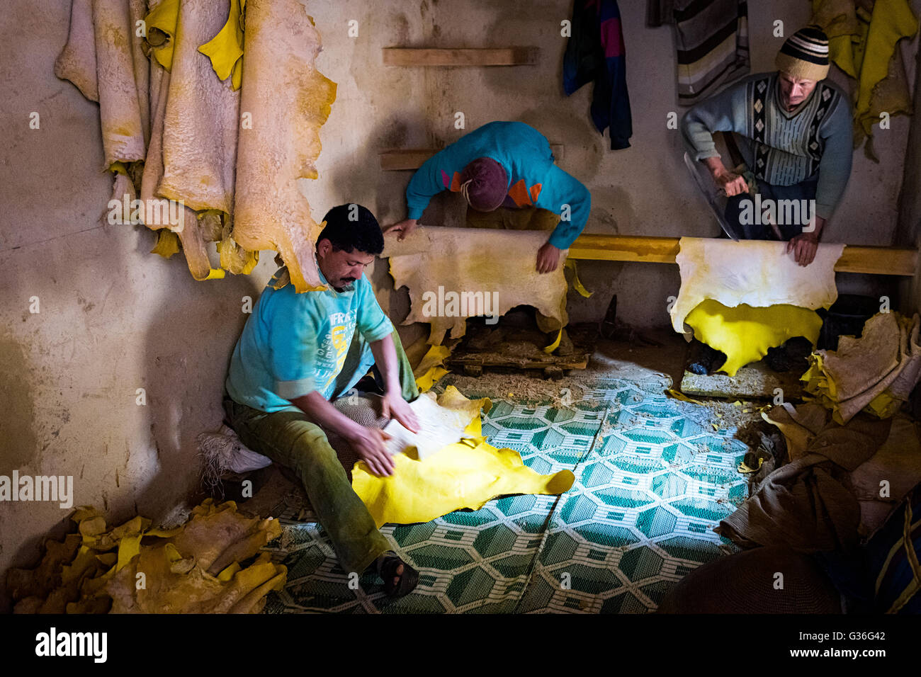 Fez, Morocco - April 11, 2016: Tree man working in a tannery in the city of Fez in Morocco. Stock Photo