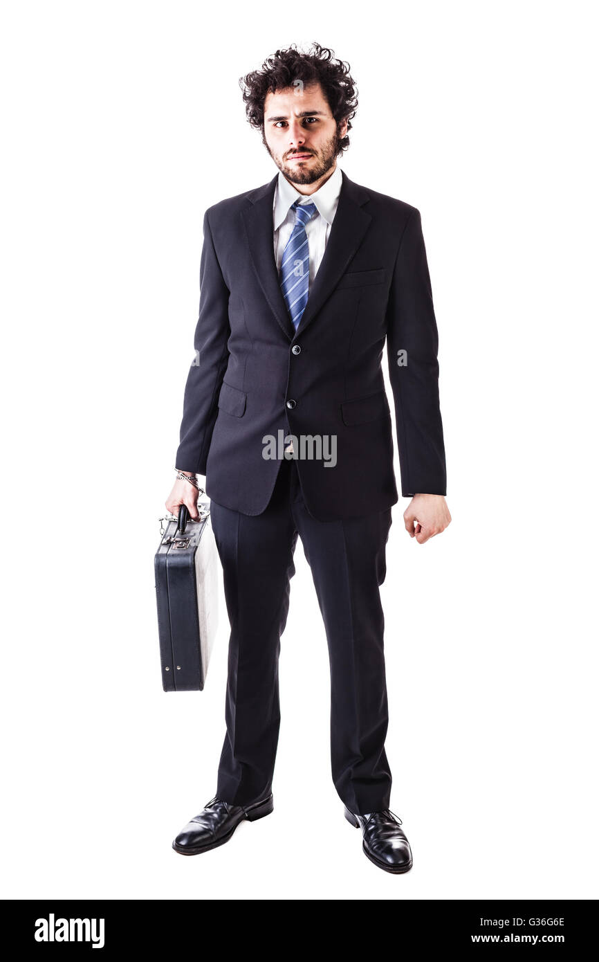 Businessman wearing a suit with a secure suitcase attached with handcuffs isolated over a white background Stock Photo