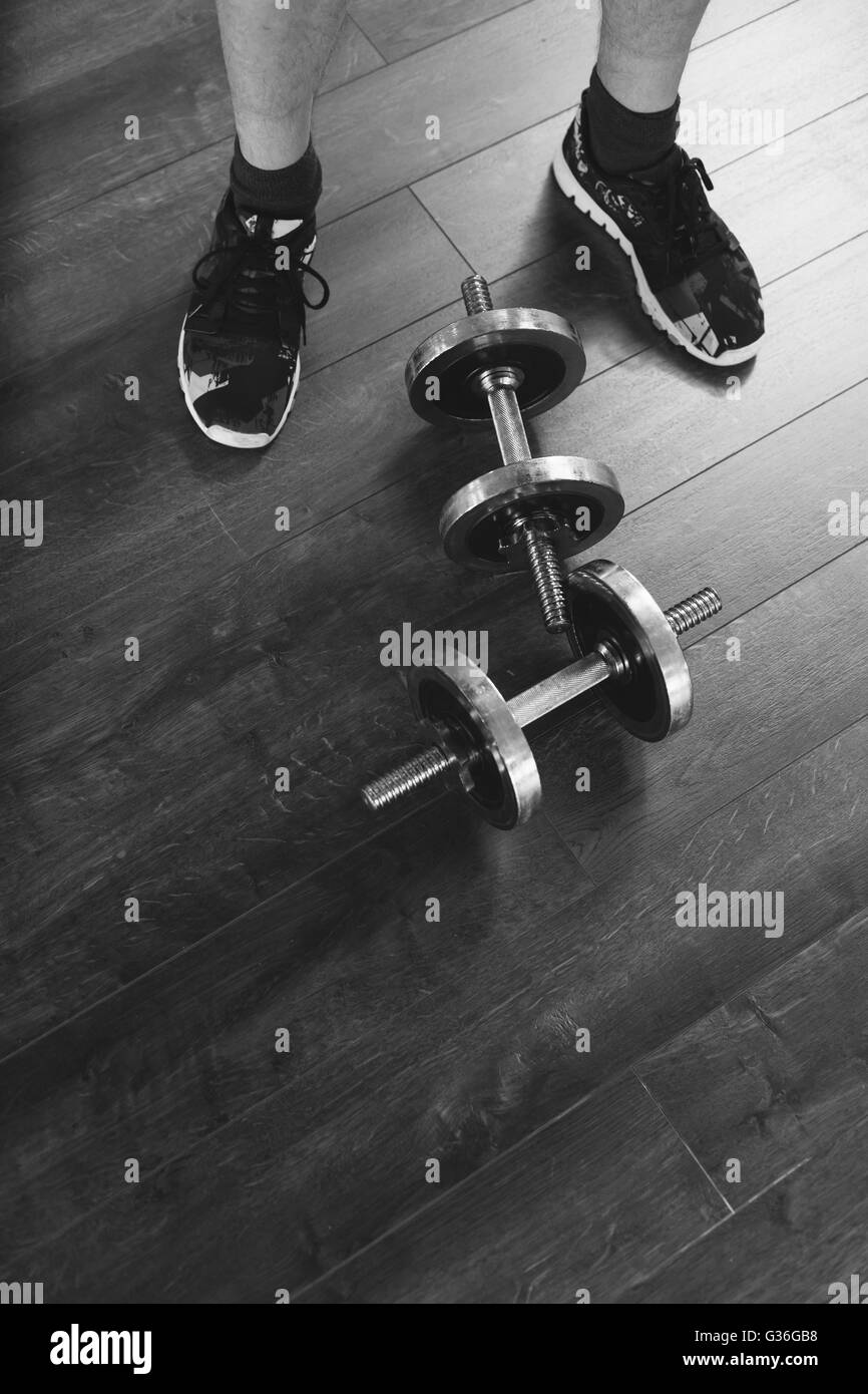 Top view of a dumbells on a wooden background in a gym, healthz lifestyle concept Stock Photo