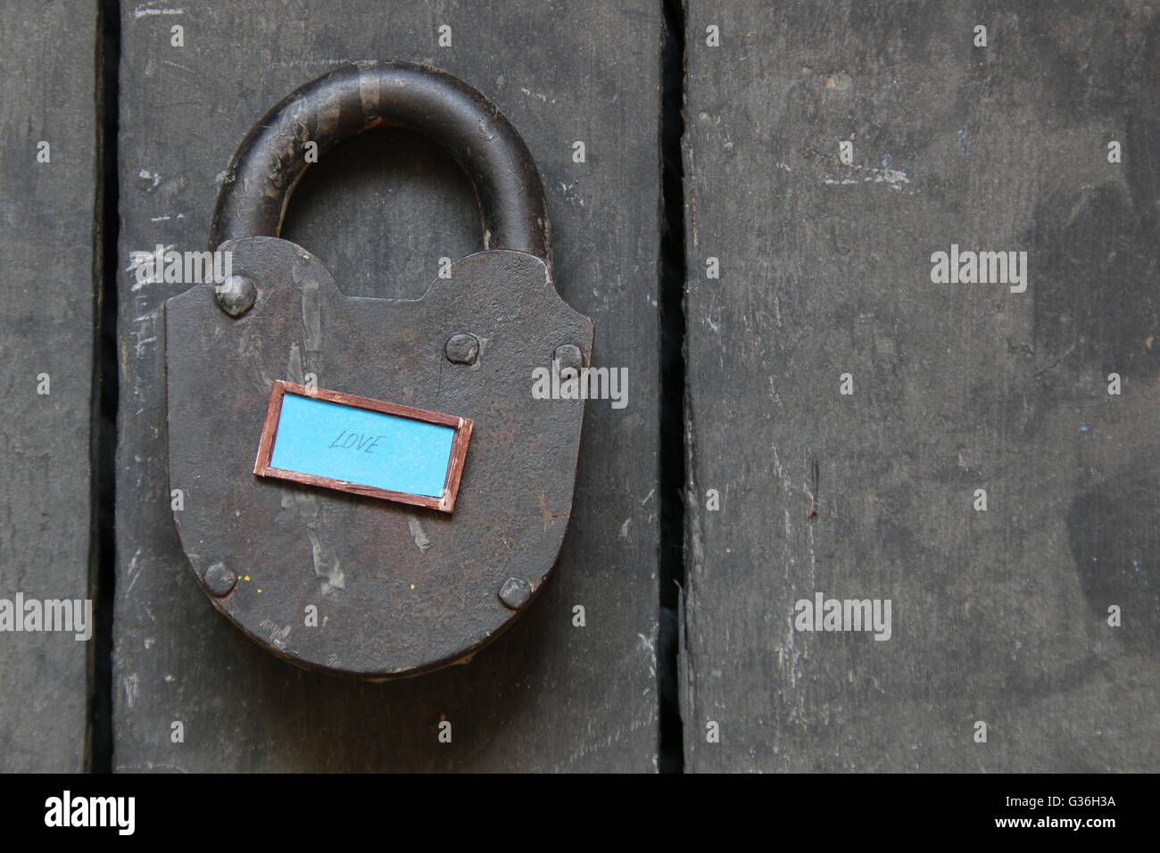 love idea, inscription and vintage padlock - valentine card Stock Photo