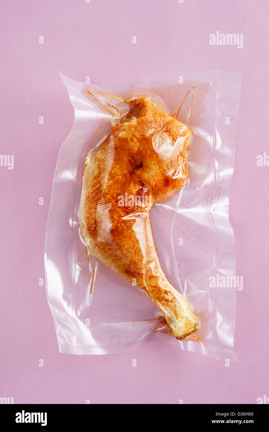 Vacuum sealed chicken thigh Stock Photo