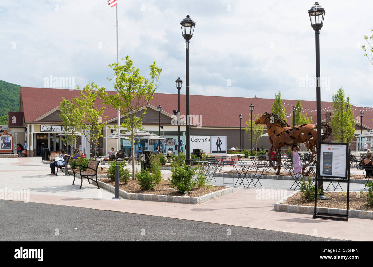 Woodbury Common outlet mall in New York looking towards the Calvin Klein  designer store and sculpture of a horse Stock Photo - Alamy