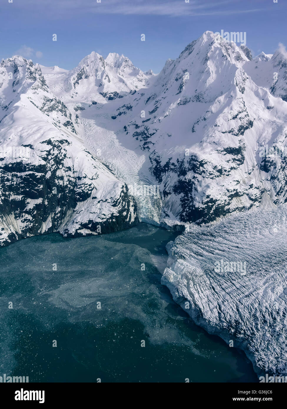 Johns Hopkins glacier in Glacier Bay National Park in Southeast Alaska as seen from the air in late winter. Stock Photo