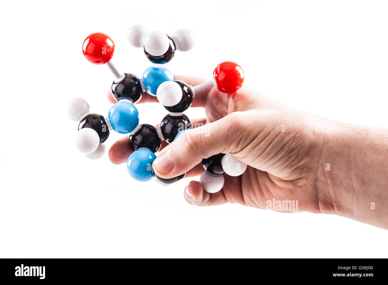 A Male Hand Holding A Caffeine Chemical Molecular Structure Model