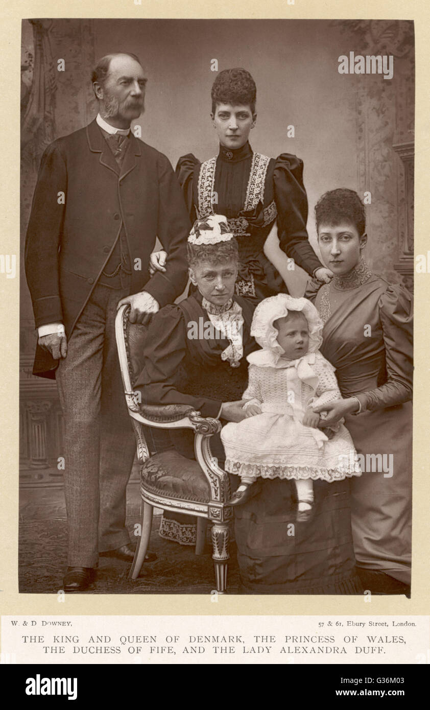 King Christian IX of Denmark (1818-1906) with his wife, Queen Louise  of Hesse-Cassel, daughter  Queen Alexandra, her daughter  Princess Louise of Wales and  her baby, Maud Duff (b. 1893). Stock Photo