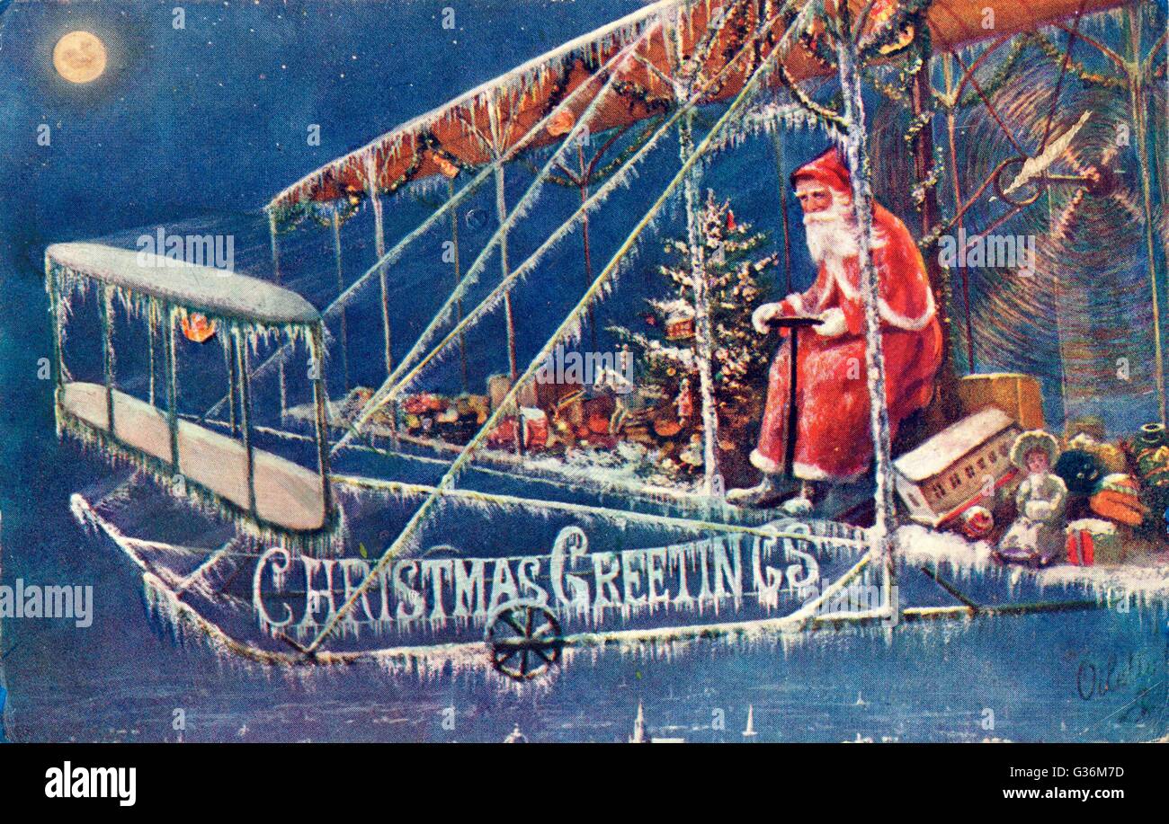 Father Christmas in a plane laden with presents Stock Image