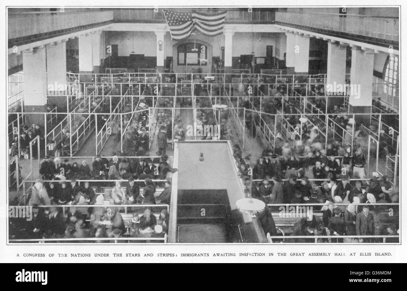 Immigrants waiting inspection in the Great Assembly Hall at  Ellis Island, New York        Date: 1911 Stock Photo