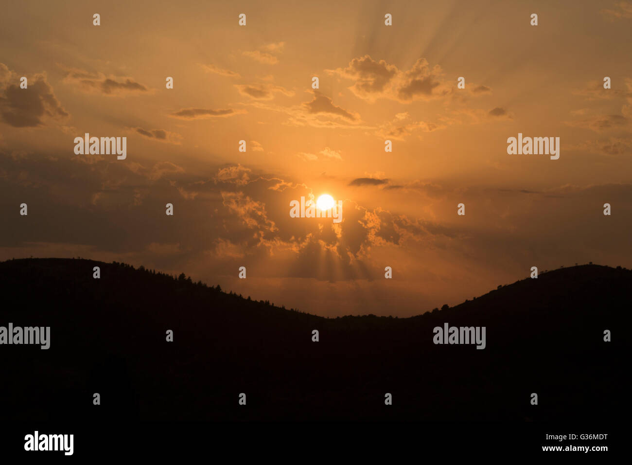 Golden sunset over mountains Stock Photo - Alamy