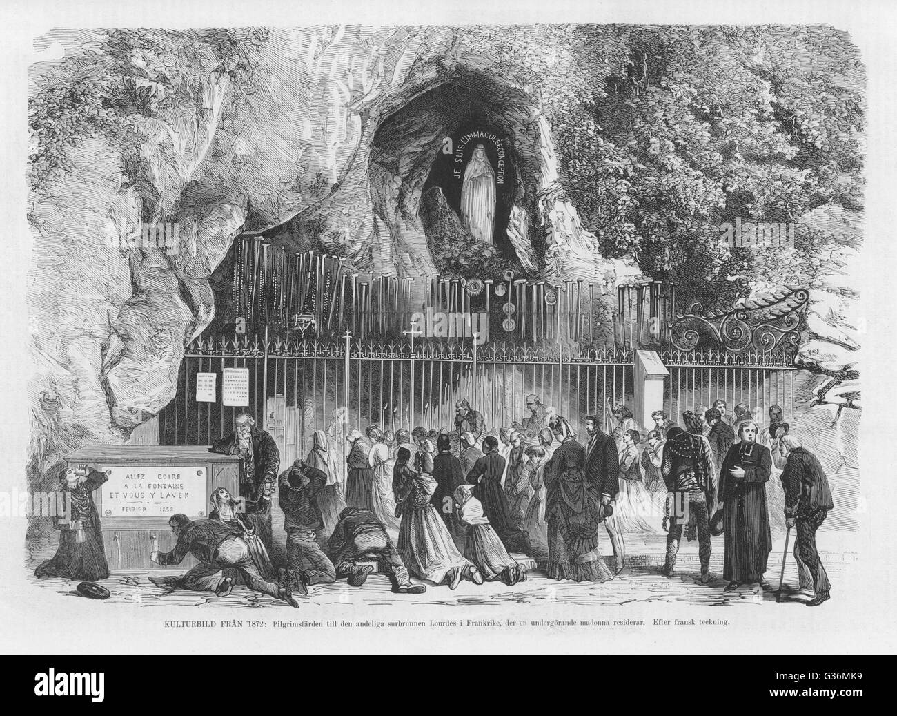 Drinking holy water at the Lourdes Grotto Stock Photo
