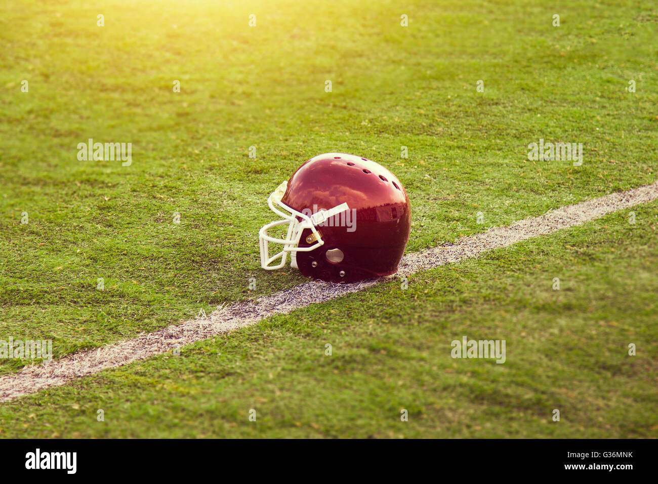 American Football Helmet on the field Stock Photo Alamy