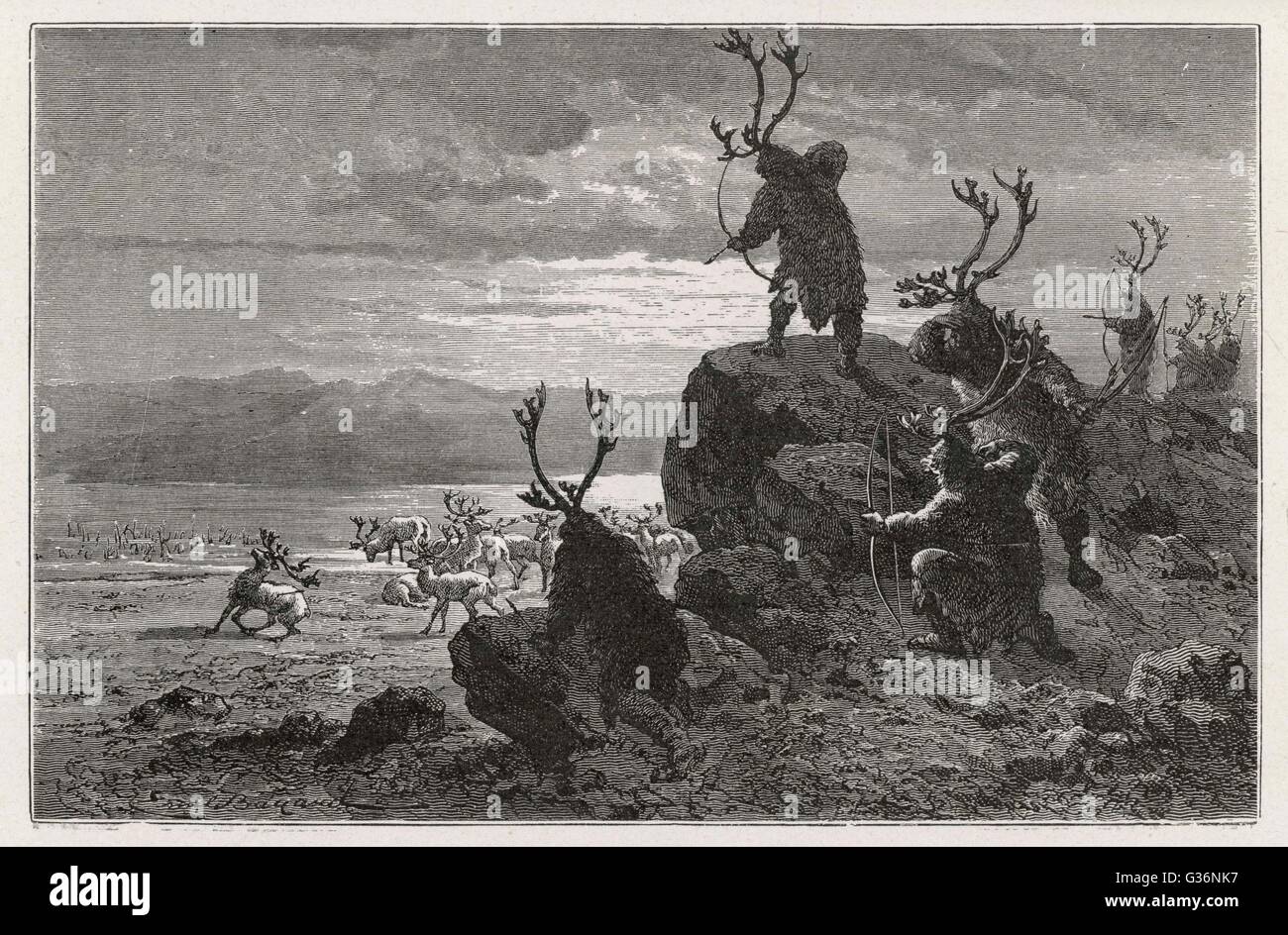 Stone Age men hunting reindeer Stock Photo