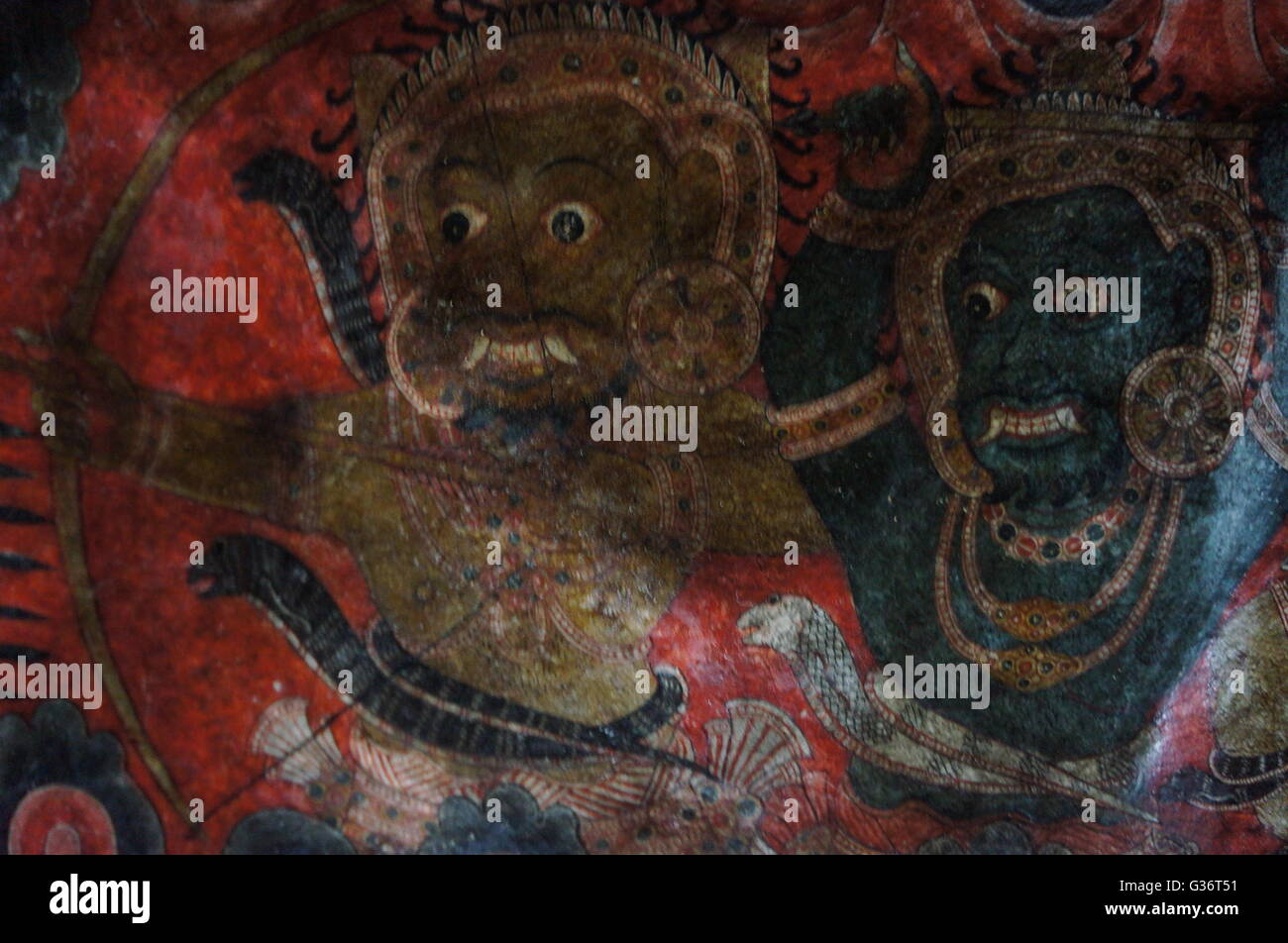 Mythological creatures painted on the wall of a Buddhist sacred cave near Kandy, Sri Lanka. Stock Photo