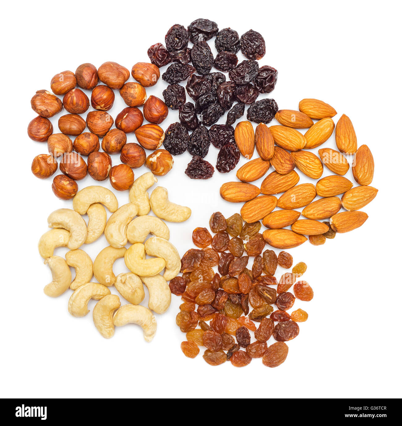 Mixed nuts and dry fruits isolated on white background Stock Photo
