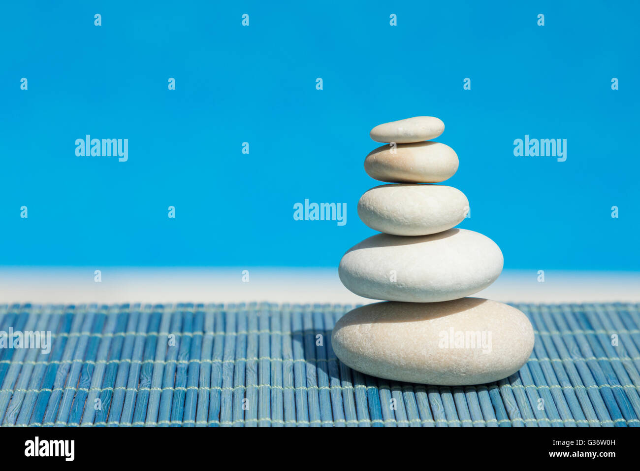 Blue Zen Rocks Zen stones on blue background Stock Photo - Alamy