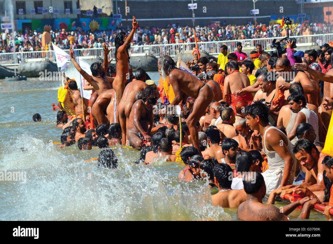 Naga sadhus bathing in the river Kshipra on 1st Royal Bath Kumbh Mela ...