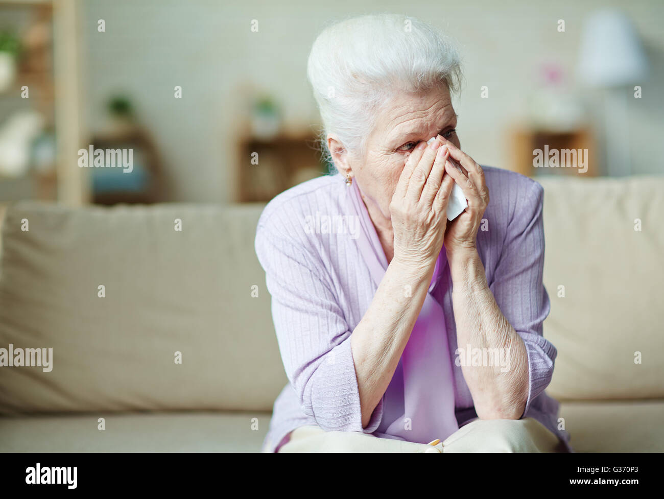 Crying elderly woman Stock Photo
