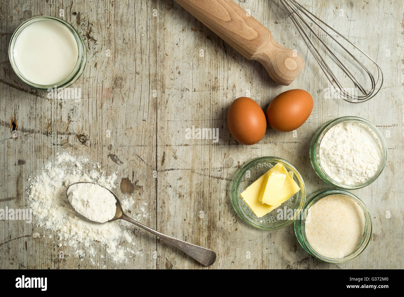 Basic pastry ingredients and baking tools on wooden counter Stock Photo ...