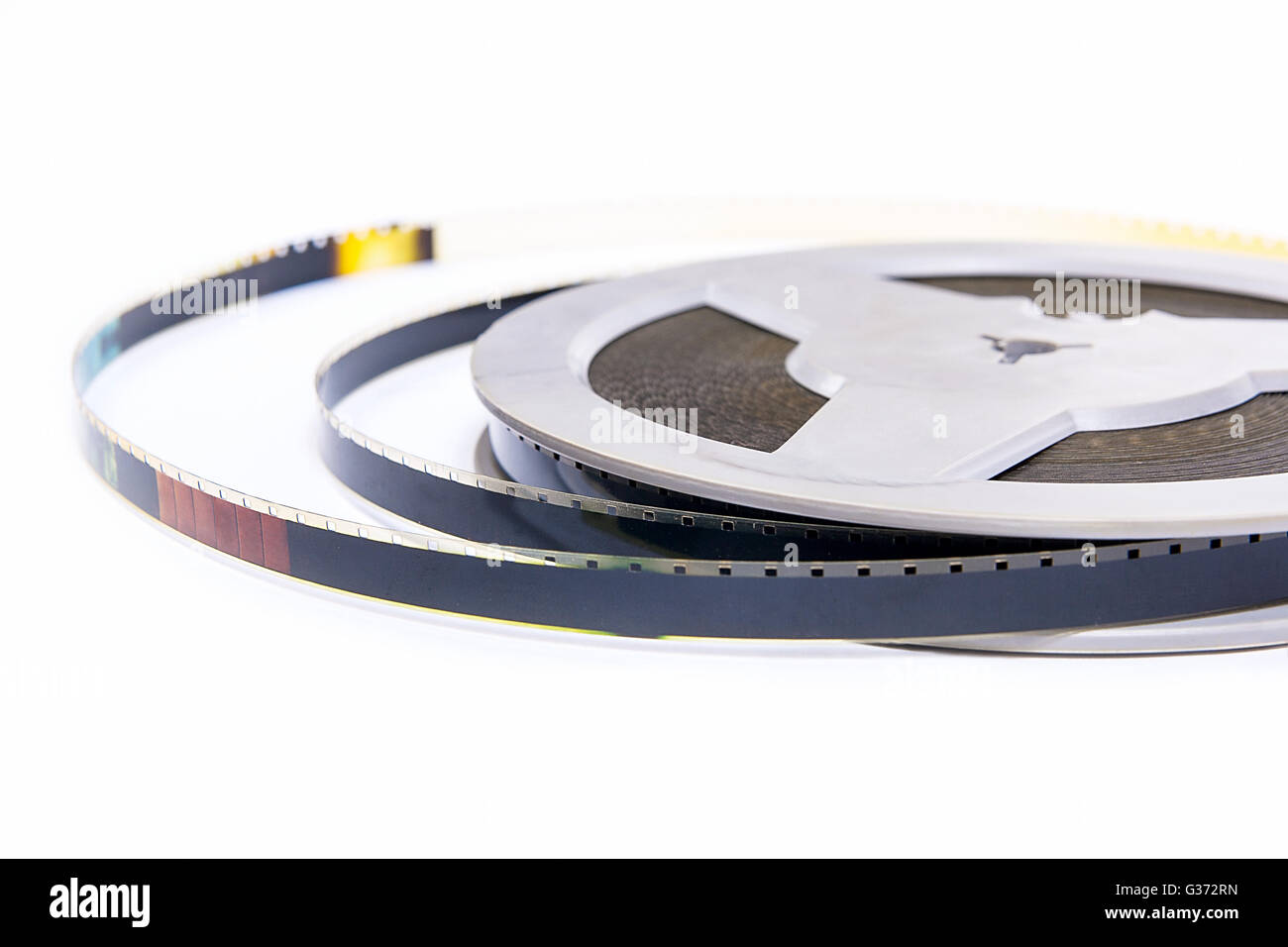 A reel of motion picture film on a white background. Old film strip ...
