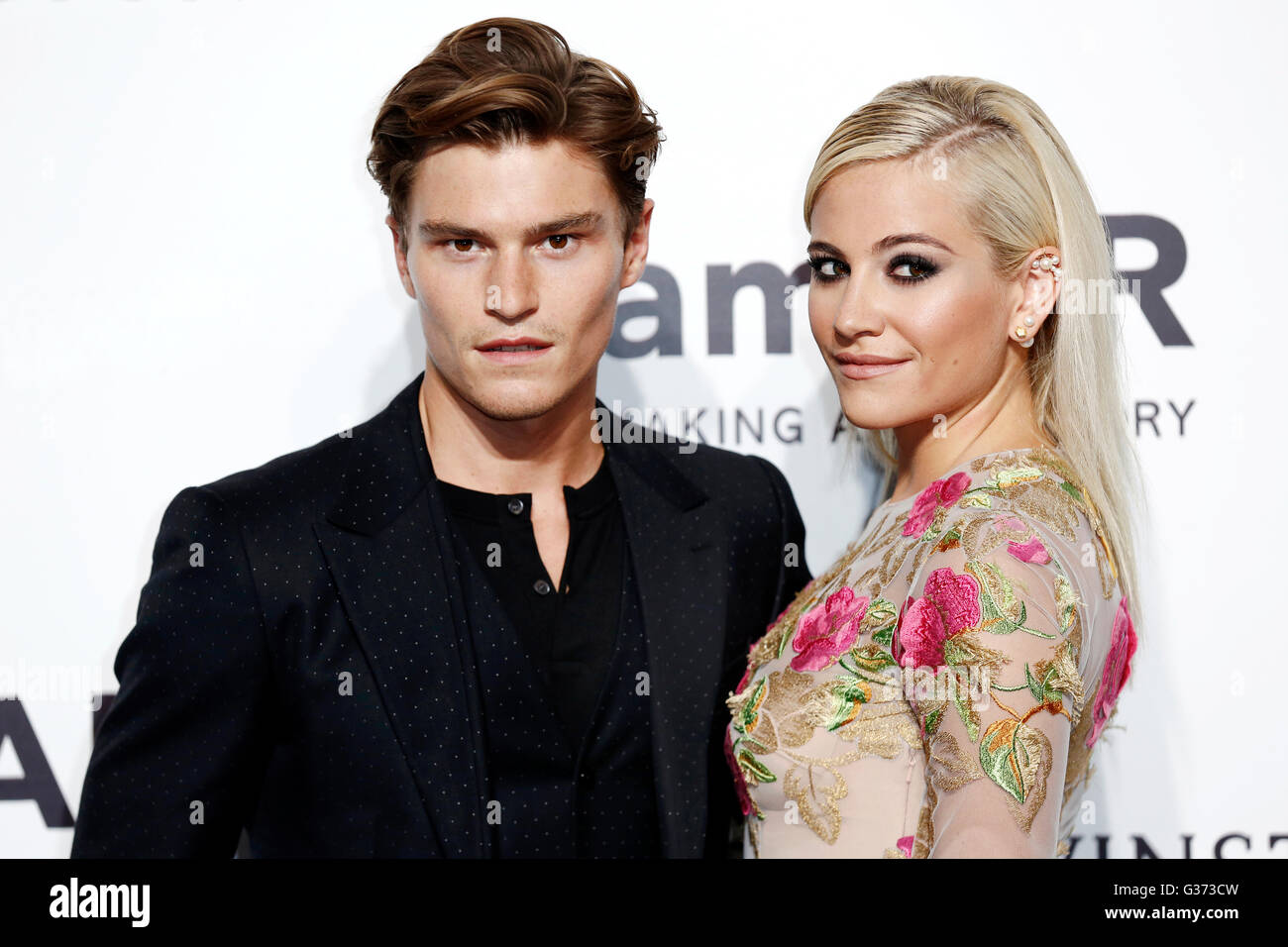 MILAN, ITALY, SEPTEMBER 26: Oliver Cheshire and Pixie Lott attend Amfar's gala night at Permanente on September 26, 2015 in Mila Stock Photo