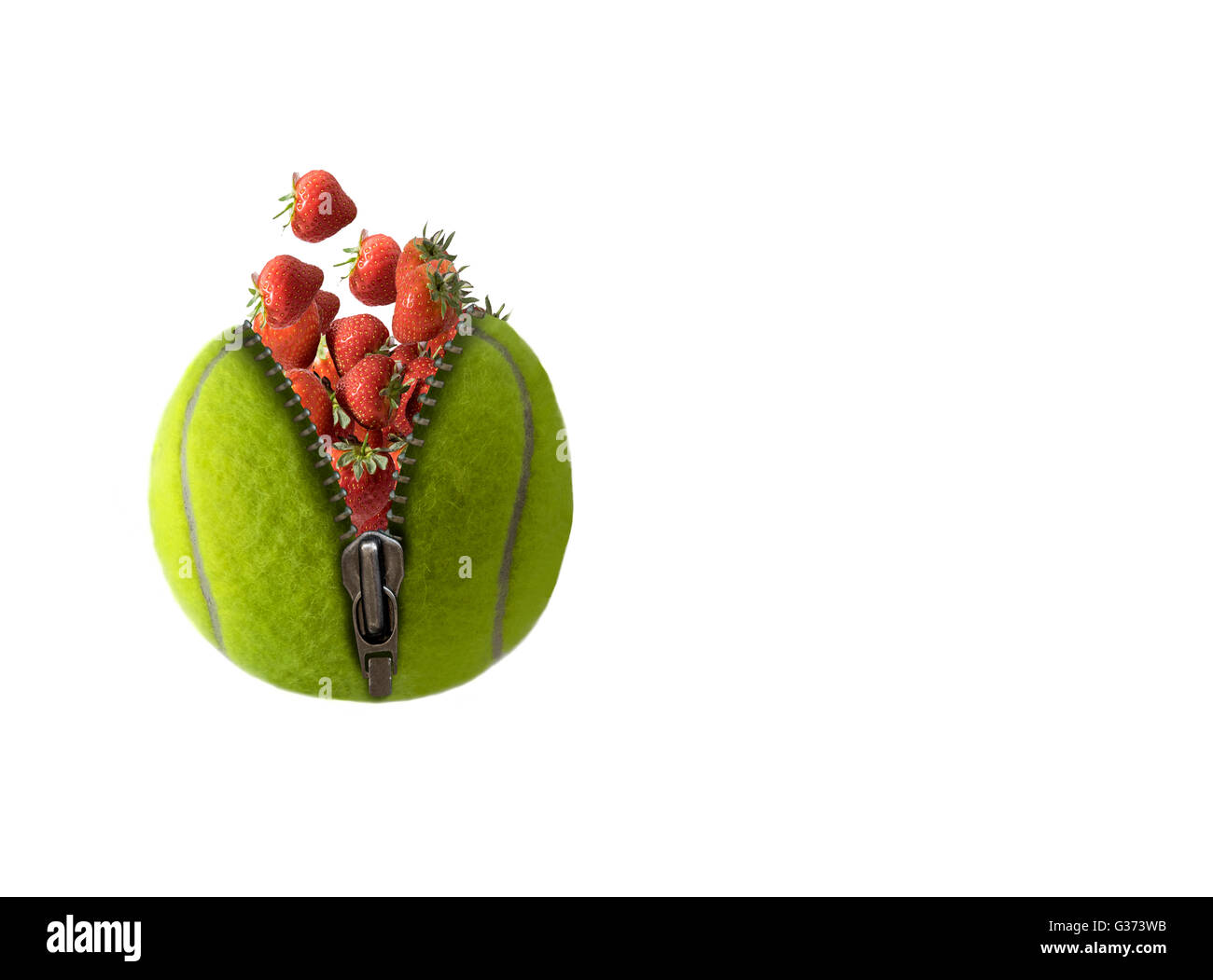 Tennis ball full of strawberries, 'unzipped ' to show the berries bursting out. On white background with copy space on the right Stock Photo