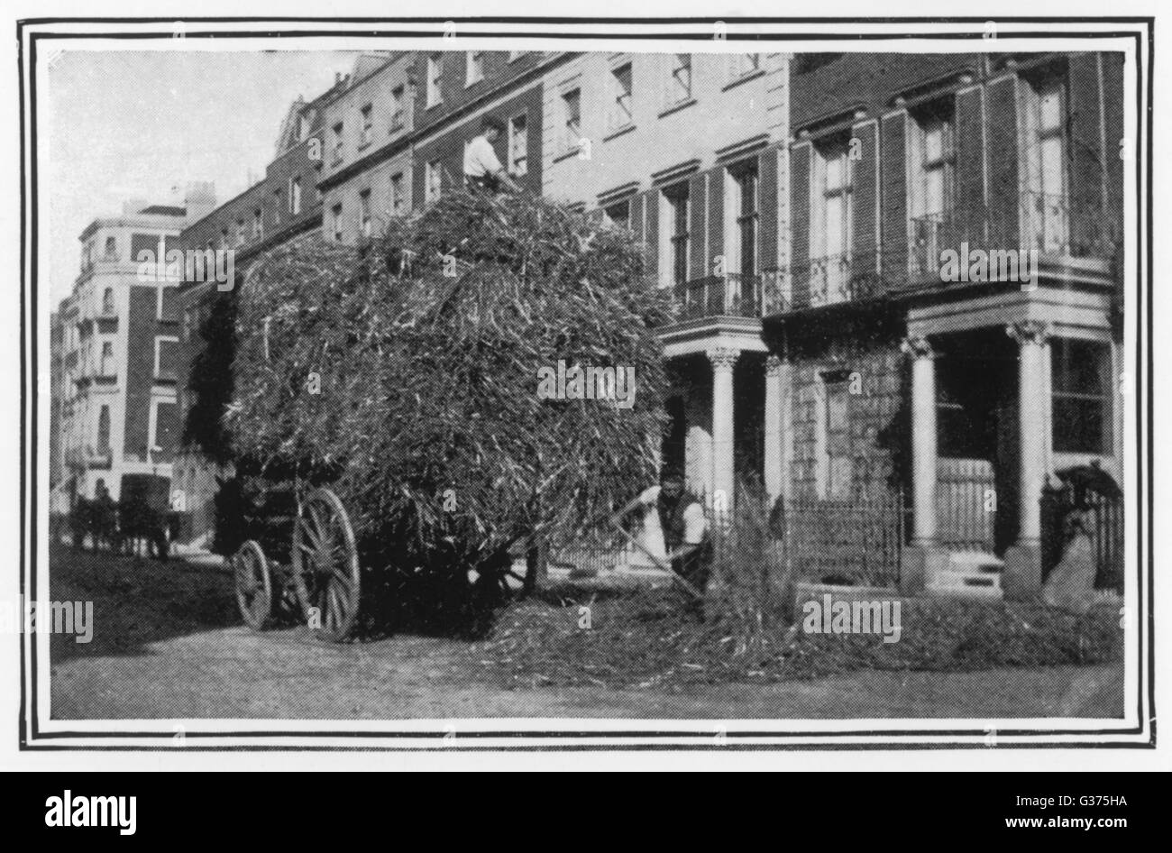 Straw is laid outside a sick  person's house         Date: 1901 Stock Photo