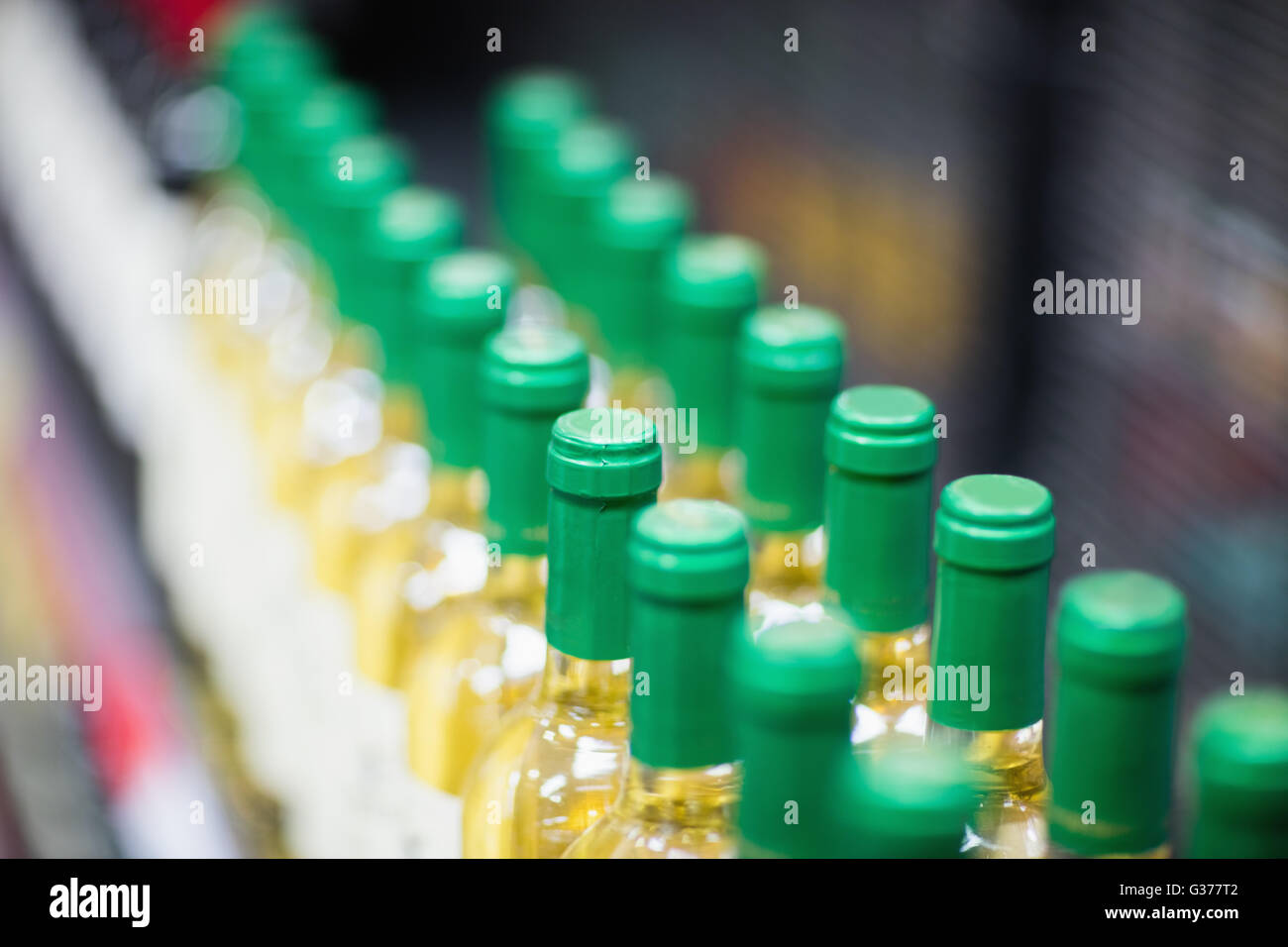 Close up of white wine bottles Stock Photo