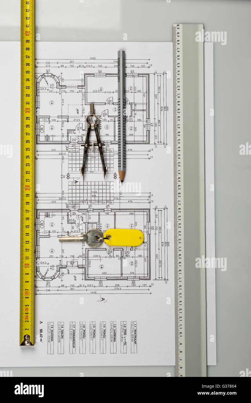 Architect plans construction project drawing, the cost of building a house Stock Photo Alamy