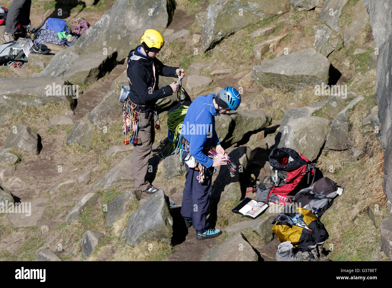 Rock climbers with ropes and safety gear in the Peak District