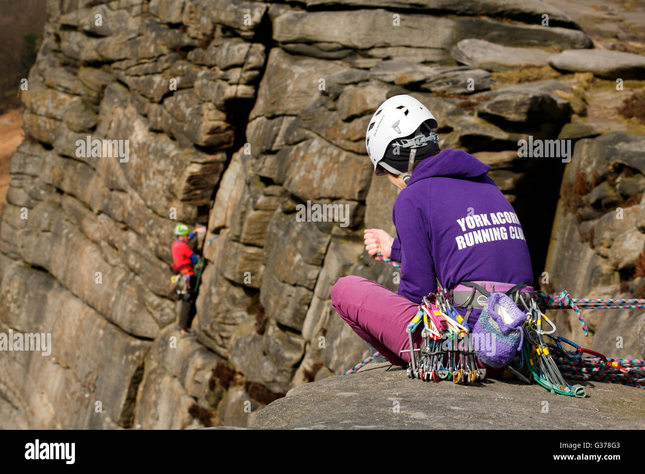 Rock climbers with ropes and safety gear in the Peak District