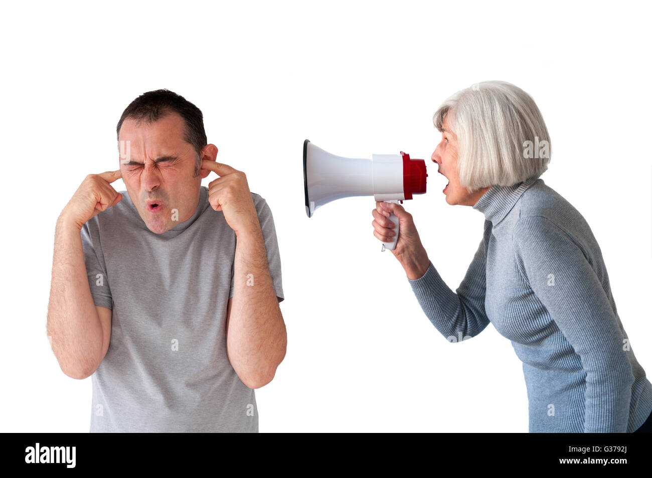 man being yelled at by senior woman on white Stock Photo