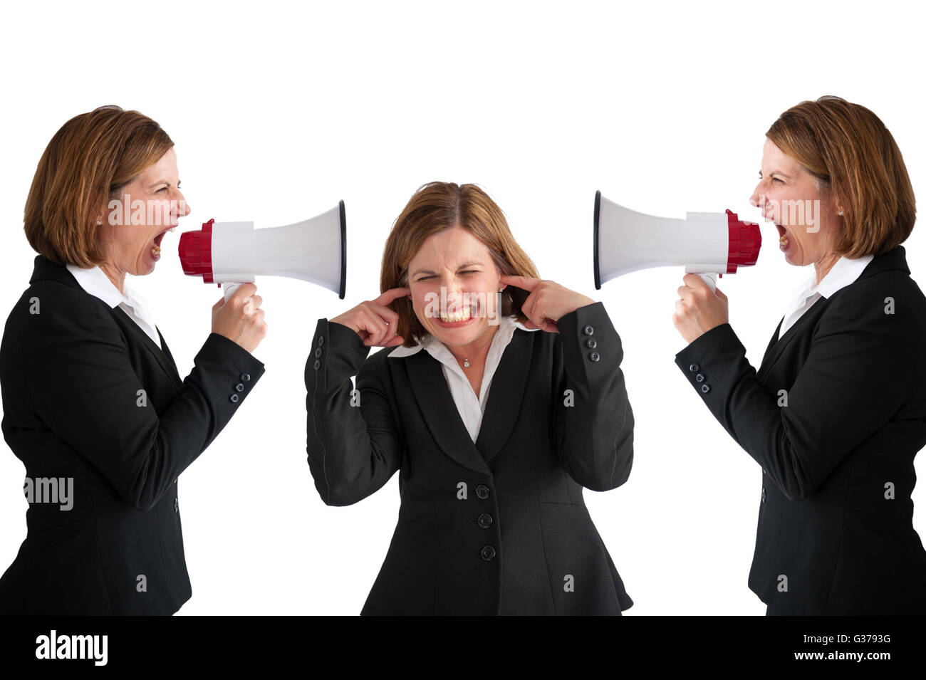 businesswoman being shouted at by businesswomen with megaphone Stock Photo