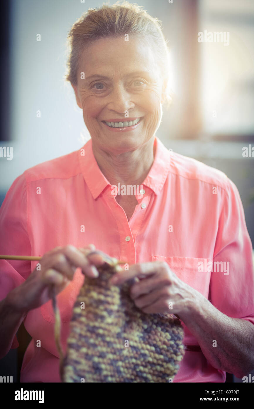 Portrait senior woman knitting wool Stock Photo - Alamy
