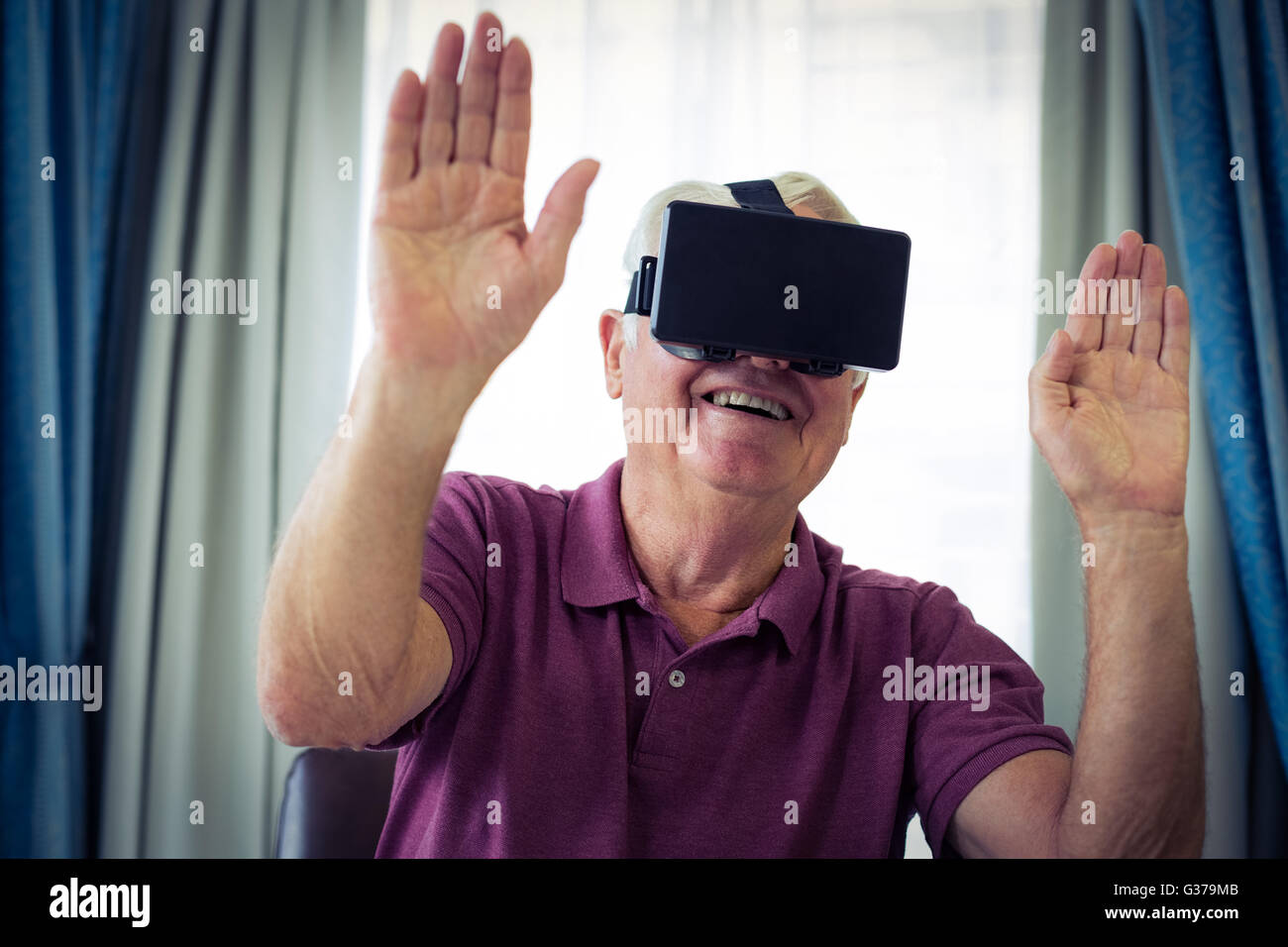 Senior man wearing virtual glasses Stock Photo