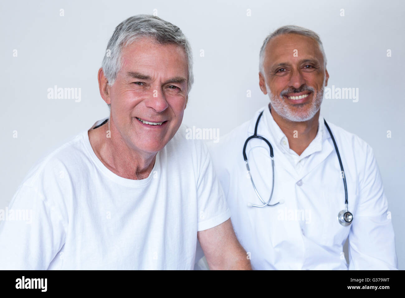 Portrait of happy male doctor and senior man Stock Photo