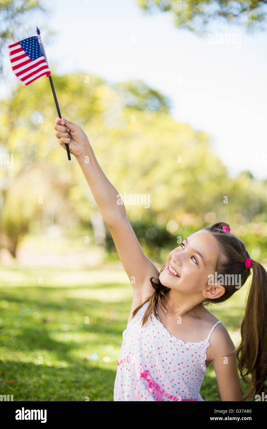 Girl holding an American flag Stock Photo - Alamy